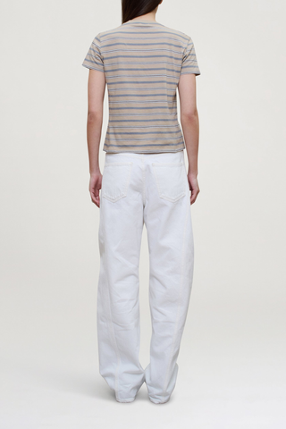 back profile model wearing Kenzie Stripe Short Sleeve T-Shirt Almond Stripe
Handmade custom stripe
Relaxed boxy fit
Subtle cropped length
Roomy sleeves
Slight taper at waist
Shifted side seams give tailored look
Solid knit binding at neckline
Features contrast Kallmeyer embroidery at hem
100% Cotton