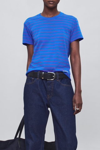 front profile model wearing  Kenzie Stripe Short Sleeve T-Shirt Cobalt blue
Relaxed boxy crop
crewneck
Features contrast Kallmeyer embroidery at hem
100% Cotton