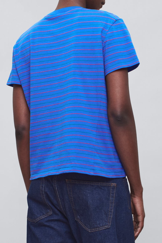 back profile model wearing  Kenzie Stripe Short Sleeve T-Shirt Cobalt blue
Relaxed boxy crop
crewneck
Features contrast Kallmeyer embroidery at hem
100% Cotton
