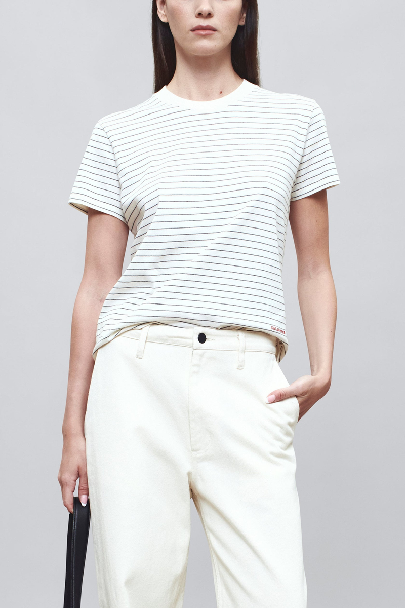 front profile model wearing  Kenzie Stripe Short Sleeve T-Shirt Ivory/Heather cotton Short sleeve
Handmade custom stripe
Relaxed boxy fit
Subtle cropped length
Roomy sleeves
Slight taper at waist