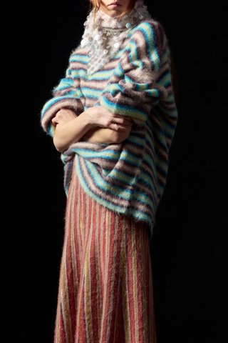 model wearing Kinga Paillette Scarf Quartz triangle shape light pink