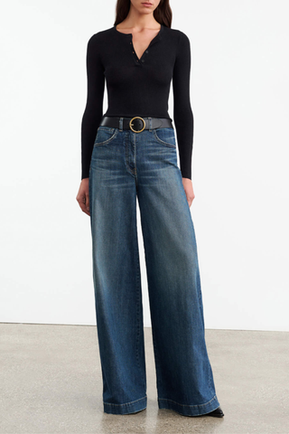 front profile model wearing Klarise Henley Knit Black wool silk Slim fit fine gauge pullover
Long sleeve henley
Regular length
Faux horn button closure
Tubular neck trim