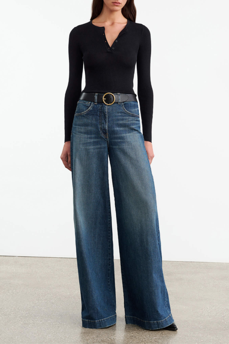 front profile model wearing Klarise Henley Knit Black wool silk Slim fit fine gauge pullover
Long sleeve henley
Regular length
Faux horn button closure
Tubular neck trim