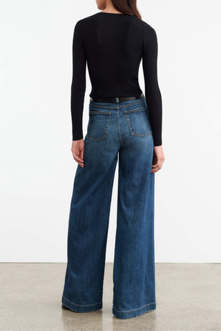 back profile model wearing Klarise Henley Knit Black wool silk Slim fit fine gauge pullover
Long sleeve henley
Regular length
Faux horn button closure
Tubular neck trim