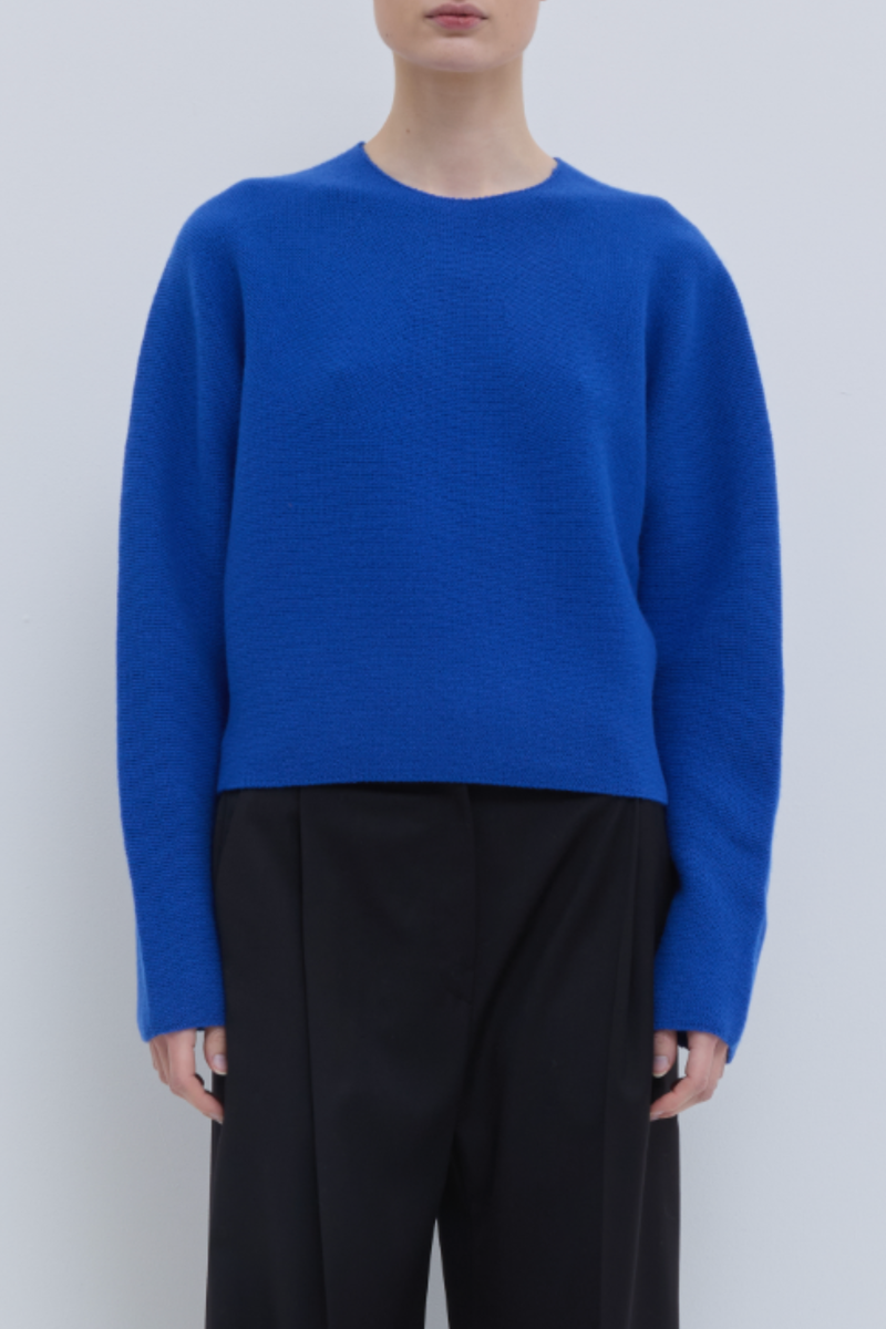 front profile model wearing Kopanos Long Sleeve Crew Klein Blue 100% Superfine Merino Wool regular fit