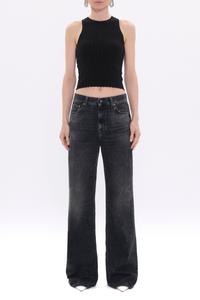 front profile model wearing Korea Denim authentic black faded wash Mid-rise denim
Slightly flared leg
Relaxed fit
Composition: 100%Cotton

Four pockets