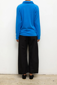back profile model wearing Kyoto Carpenter Pant Black cotton Classic utility inspired trouser
Pull-on style
Baggy leg silhouette
Hits at the ankle
Topstitched utility panels at front
Adjustable waistband
Patch pockets at back