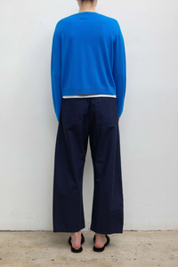 back profile model wearing Kyoto Carpenter Pant Nuit Classic utility inspired trouser
Pull-on style
Baggy leg silhouette
Hits at the ankle
Topstitched utility panels at front
Adjustable waistband
Patch pockets at back
