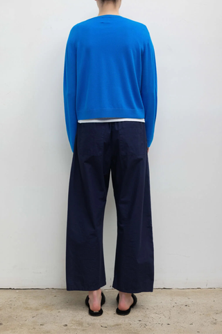 back profile model wearing Kyoto Carpenter Pant Nuit Classic utility inspired trouser
Pull-on style
Baggy leg silhouette
Hits at the ankle
Topstitched utility panels at front
Adjustable waistband
Patch pockets at back