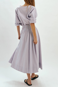 back profile model wearing Kyria Poplin Striped Skirt Chambray/Poppy Stripe Full skirt
Elastic waistband
100% cotton
