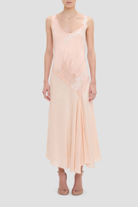 front profile model wearing Lace Strap Dress Blossom peach pink Ankle length with asymmetric hem
Drape fabrication
Round front neckline
Covered back
Sleeveless
Trim lace detail
Zip fastening
71% Acetate 29% Viscose