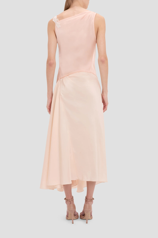 back profile model wearing Lace Strap Dress Blossom peach pink Ankle length with asymmetric hem
Drape fabrication
Round front neckline
Covered back
Sleeveless
Trim lace detail
Zip fastening
71% Acetate 29% Viscose