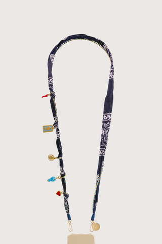flat lay Laia Long Phone Chain Blue Straps can be worn on the shoulder, in the hand or even hung on your bag for a new handle.
Can remove the chain easily and at any time, and exchange it
Can adapt your hull with different chains
Attach to universal adapter, available to purchase separately.
Phone case is sold separately
Fabric bandana
Charms included