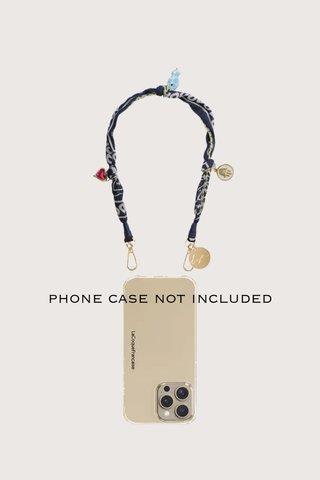phone demonstration with Laia Short Phone Chain Blue Short phone chain
Chain easily attaches to the rings of La Coque Francaise phone cases. If you don't have a ring case, a universal adapter is available - sold separately.

Composition: cotton voile and charms
Finishes: swivel carabiners and stainless steel rings
Length: 40 cm
