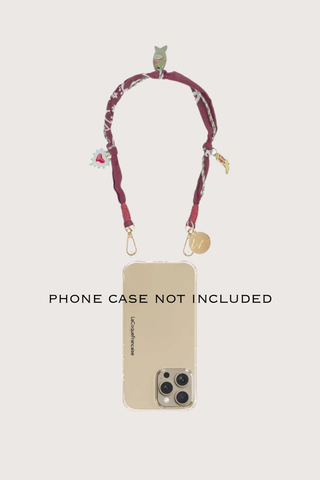 phone demonstration with Laia Short Phone Chain Bordeaux Short phone chain
Chain easily attaches to the rings of La Coque Francaise phone cases
.If you don't have a ring case, a universal adapter is available - sold separately.

Composition: cotton voile and charms
Finishes: swivel carabiners and stainless steel rings
Length: 40 cm