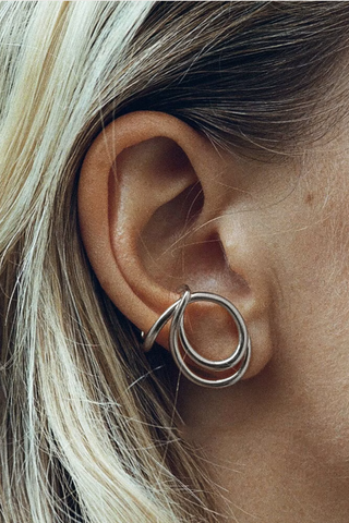 model wearing  Lasso Single Earring Silver Sold as a single earring
925 Rhodium Plated Sterling Silver