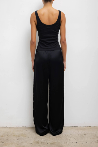 back profile model wearing  Laura Scoop Neck Tank Black Scoop Neck
Classic silhouette
Lightweight
Vintage-feel
100% Cotton