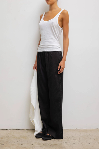 side profile model wearing  Laura Scoop Neck Tank White Scoop Neck
Classic silhouette
Lightweight
Vintage-feel
100% Cotton