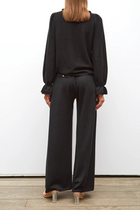 back profile model wearing Lauren Fluid Knit Trouser Black wool scallop waistband