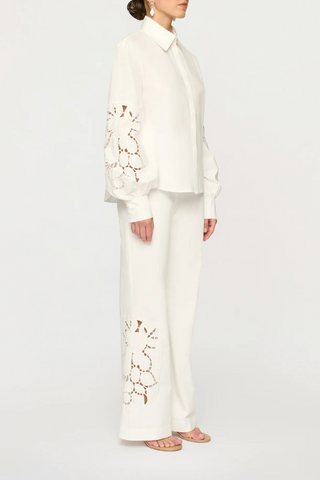 side profile model wearing Lavinia Long Sleeve Shirt cotton white with embroidery sleeve details