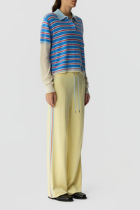 side profile model wearing Layered Stripe Rugby Cashmere Clear Sky Combo LIGHT-WEIGHT STRIPED RUGBY
RIB POLO COLLAR
HIDDEN THREE BUTTON HALF PLACKET CLOSURE
DOUBLE LAYER SLEEVE- LONG SLEEVE IN FEATHER WEIGHT CASHMERE WITH RIB CUFF
DOUBLE LAYER HEM TRIM WITH SIDE SLIT
BACK NECK GIR BRANDING