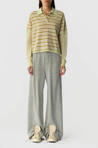 front profile model wearing Layered Stripe Rugby Cashmere Limewash Combo LIGHT-WEIGHT STRIPED RUGBY
RIB POLO COLLAR
HIDDEN THREE BUTTON HALF PLACKET CLOSURE
DOUBLE LAYER SLEEVE- LONG SLEEVE IN FEATHER WEIGHT CASHMERE WITH RIB CUFF
DOUBLE LAYER HEM TRIM WITH SIDE SLIT
BACK NECK GIR BRANDING