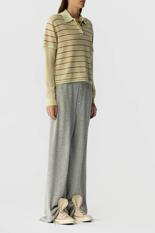 side profile model wearing Layered Stripe Rugby Cashmere Limewash Combo LIGHT-WEIGHT STRIPED RUGBY
RIB POLO COLLAR
HIDDEN THREE BUTTON HALF PLACKET CLOSURE
DOUBLE LAYER SLEEVE- LONG SLEEVE IN FEATHER WEIGHT CASHMERE WITH RIB CUFF
DOUBLE LAYER HEM TRIM WITH SIDE SLIT
BACK NECK GIR BRANDING