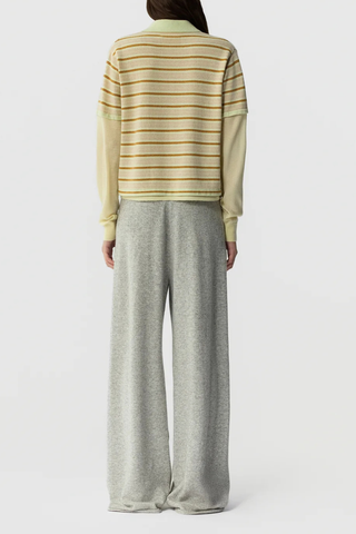 back profile model wearing Layered Stripe Rugby Cashmere Limewash Combo LIGHT-WEIGHT STRIPED RUGBY
RIB POLO COLLAR
HIDDEN THREE BUTTON HALF PLACKET CLOSURE
DOUBLE LAYER SLEEVE- LONG SLEEVE IN FEATHER WEIGHT CASHMERE WITH RIB CUFF
DOUBLE LAYER HEM TRIM WITH SIDE SLIT
BACK NECK GIR BRANDING