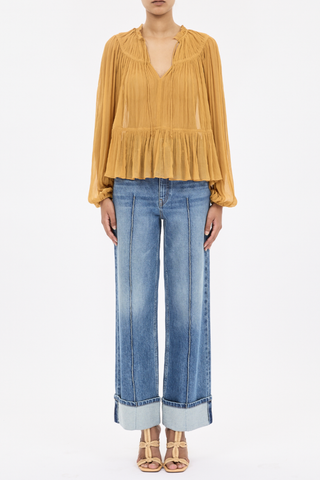front profile model wearing  Leandra Silk Crinkle Solid blouse ochre Crinkled silk chiffon
V-neckline with ties
Voluminous long sleeves with elastic cuffs