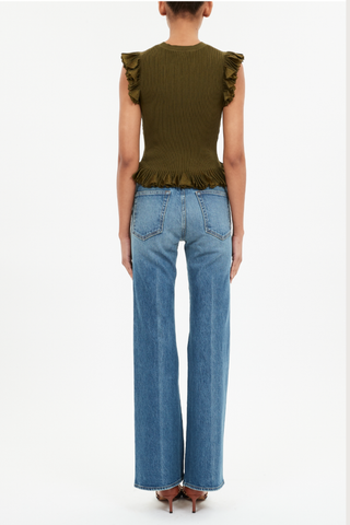 back profile model wearing Leila Top Olive Ruffled hem
Sunburst knit rendered in a lush green hue with shimmering lurex. slim fit
Crew neckline
Flutter sleeves