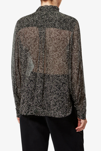 back profile model wearing Leona Printed Top black ecru Lightweight printed muslin blouse
Stand-up collar with pussy bow
Long sleeves with buttoned cuffs
Asymmetrical opening