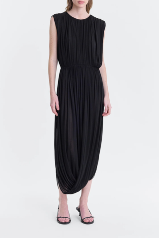 front profile model wearing Leonora Draped Column Dress Black Fluid, lightweight crepe jersey dress
Intentional gathering at the waist for subtle shaping
Hook-n-eye closure in the back
88% cupro, 12% elastane