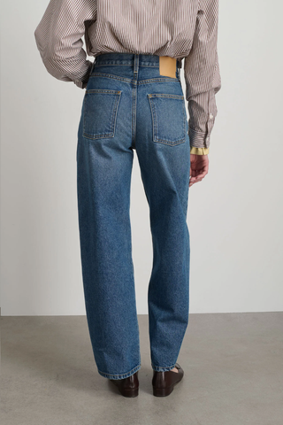 back profile model wearing Leroy Mid Relaxed Jean  blue wash Arched leg shape Mid rise Relaxed fit Barrel-legged silhouette