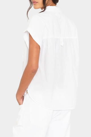 back profile model wearing Lexi Short Sleeve Shirt White cotton Button-front shirt
Left chest pocket
Cap sleeves
Softly shirred shoulders
Back yoke finished
Button-tab detail