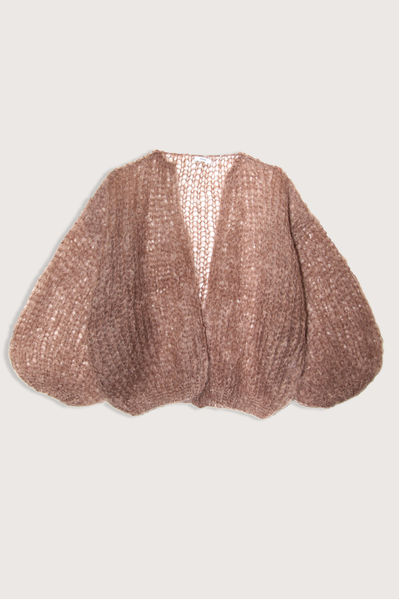 flat lay Light Mohair Bomber Cardigan Brown Relaxed bomber shape that frames the shoulders
Ultra-light mohair knit created from a single yarn strand
Airy texture that adds subtle depth without weight
75% Mohair, 20% Wool, and 5% Polyamide