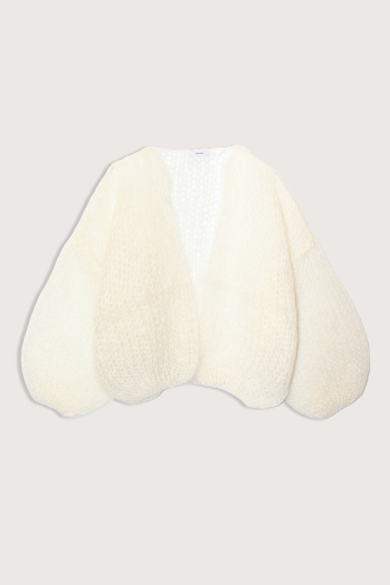 flat lay Light Mohair Bomber Cardigan Creme Relaxed bomber shape that frames the shoulders
Ultra-light mohair knit created from a single yarn strand
Airy texture that adds subtle depth without weight
75% Mohair, 20% Wool, and 5% Polyamide