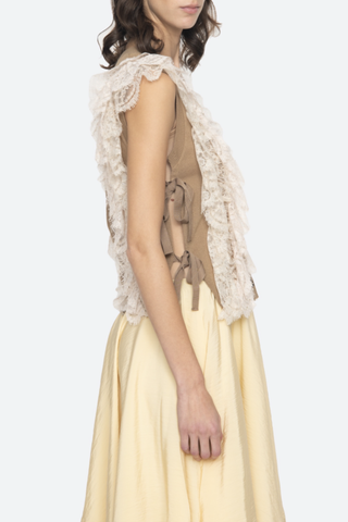 side profile model wearing Lisette Solid Sweater Vest khaki Lace Detail
V-neckline
Button front closure
Wool lace combo
Cap sleeve
Tie detail on the side
Self: 100% Wool | Decoration: 100% Polyamide