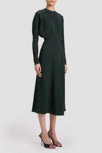 side profile model wearing Long Sleeve Dolman Midi Dress dark pine