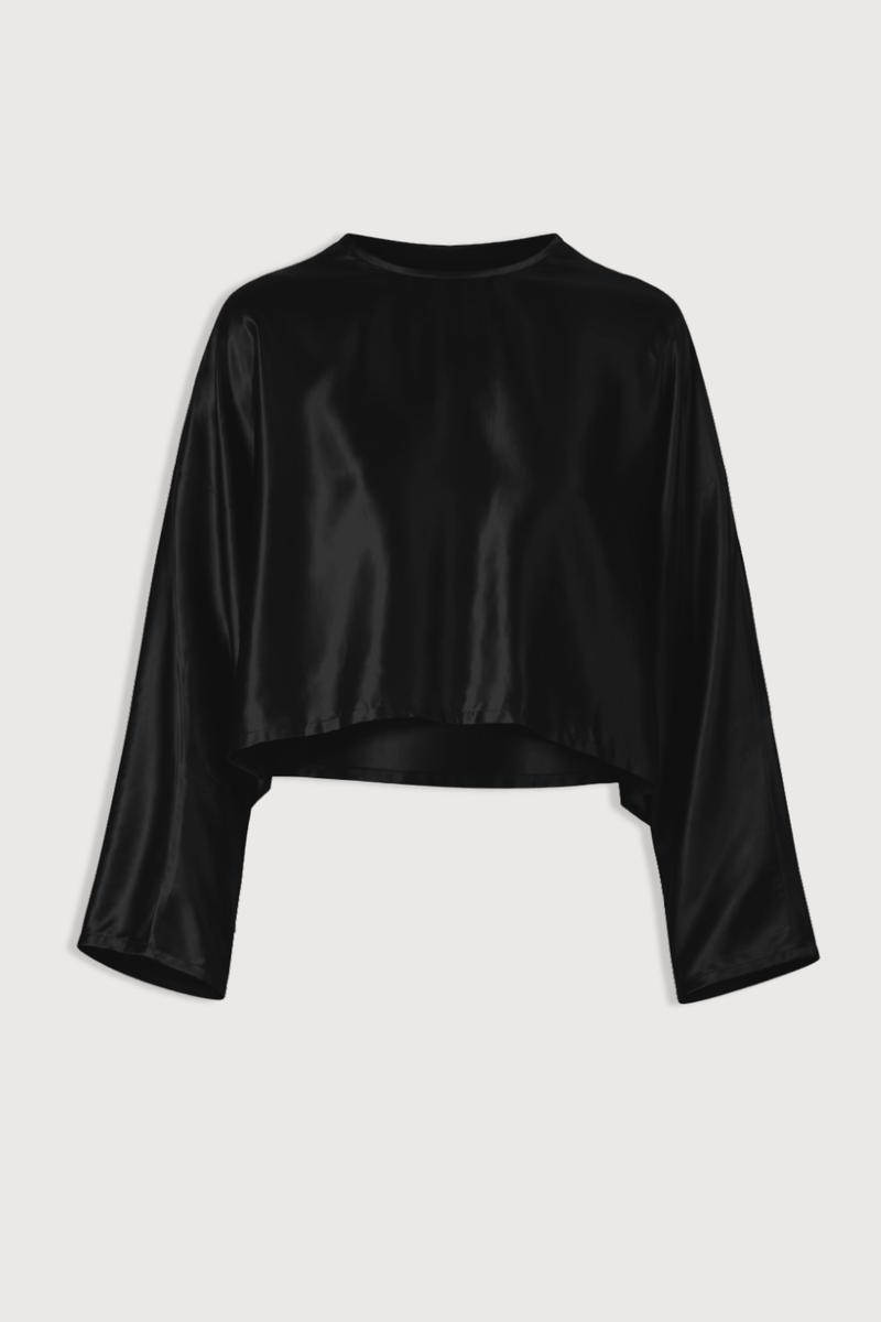 flat lay Louise Blouse Black Long length
Clean, refined hem
Crew neck
Relaxed fit
77% Acetate, 23% Polyester