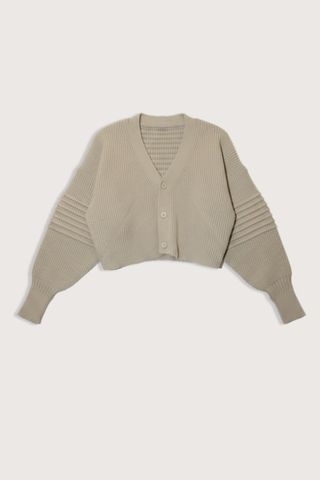 flat lay Low Gauge Cropped Cardigan Beige V-neck
Button closure
Voluminous knit with a chunky gauge
Pin-tuck design on sleeves
100% Polyester