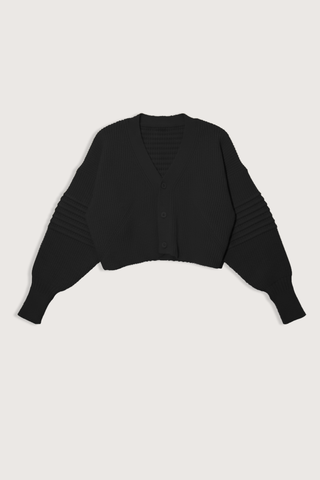 flat lay Low Gauge Cropped Cardigan Black V-neck
Button closure
Voluminous knit with a chunky gauge
Pin-tuck design on sleeves
100% Polyester