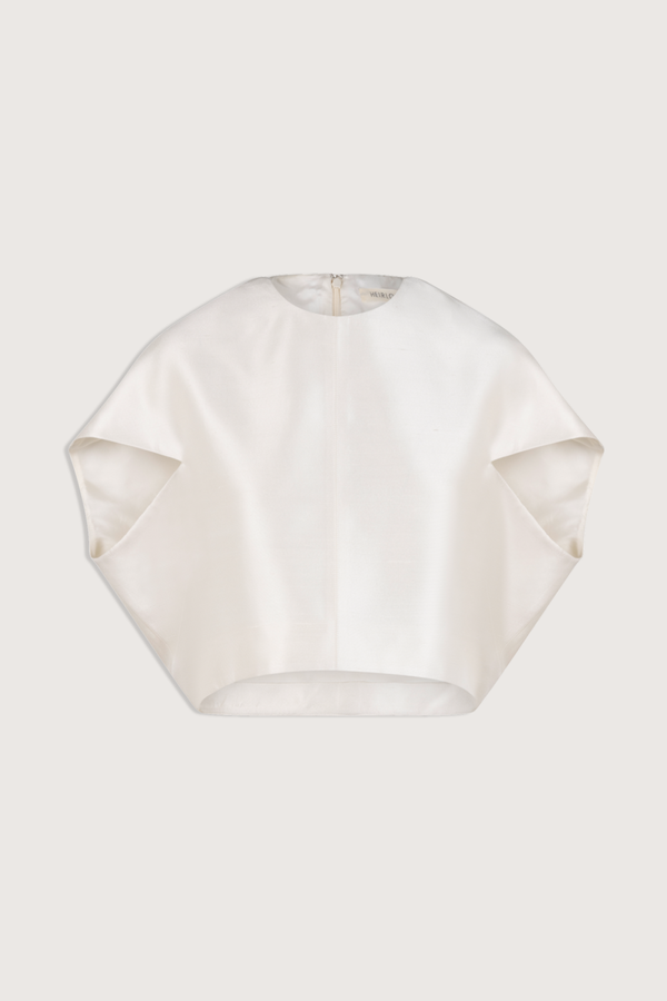 flat lay Lulu Silk Shantung Top ivory Crew neck top
Forward facing petal sleeves
Italian silk shantung fabric
Cropped silhouette
High-low hem
Center back invisible zipper for closure
Silk lining