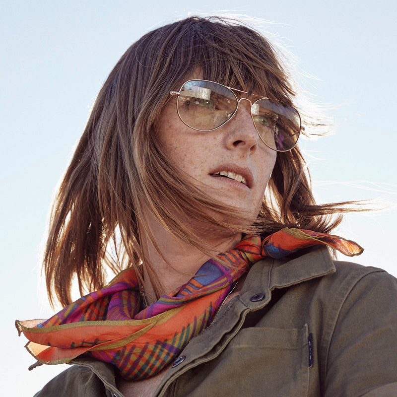 model wearing Mabuhay Reading Glasses  Rose Gold Green +0.00 gold frame green tint lens