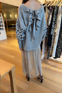 back profile model wearing Maren Pleated Soft Metallic midi Skirt sterling silver