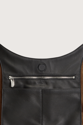 inside magnetic closure, zipper and logo detail for Market Tote Suede Bag suede rider chocolate brown Shoulder style
Magnetic closure
One internal zip pocket
Internal slide-in phone pocket
Smooth suede exterior
Round shape
Tapered straps
100% Calfskin Suede