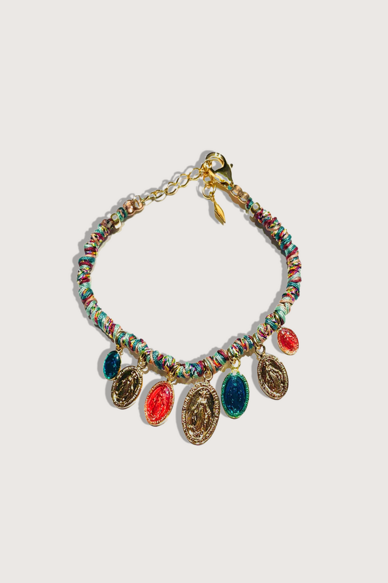 flat lay Masai Virgo Hand crocheted bracelet with colourful cords and gold plated enamel beads