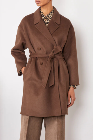 front profile model wearing Mavie Double Split Wool Belted Coat iced coffee brown Midi-length double breasted coat with a 0 shawl collar. Four covered buttons. Oversized fit. Side pockets at the side seam. Self fabric belt. 

