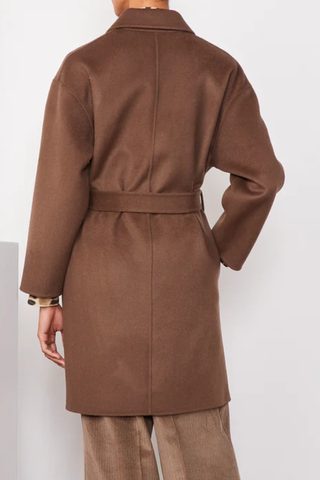 back profile model wearing Mavie Double Split Wool Belted Coat iced coffee brown Midi-length double breasted coat with a 0 shawl collar. Four covered buttons. Oversized fit. Side pockets at the side seam. Self fabric belt. 
