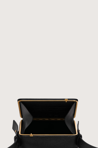 opened view of Maya Brandon Black Bag pebbled leather exterior back pocket adjustable strap structured square shape with Stainless steel frame is 24k gold-plated and seven interior card slots