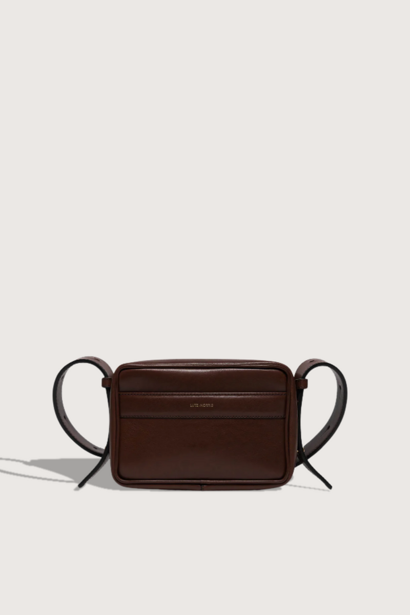 flat lay Maya cooper chocolate Bag smooth leather exterior back pocket adjustable strap structured square shape
